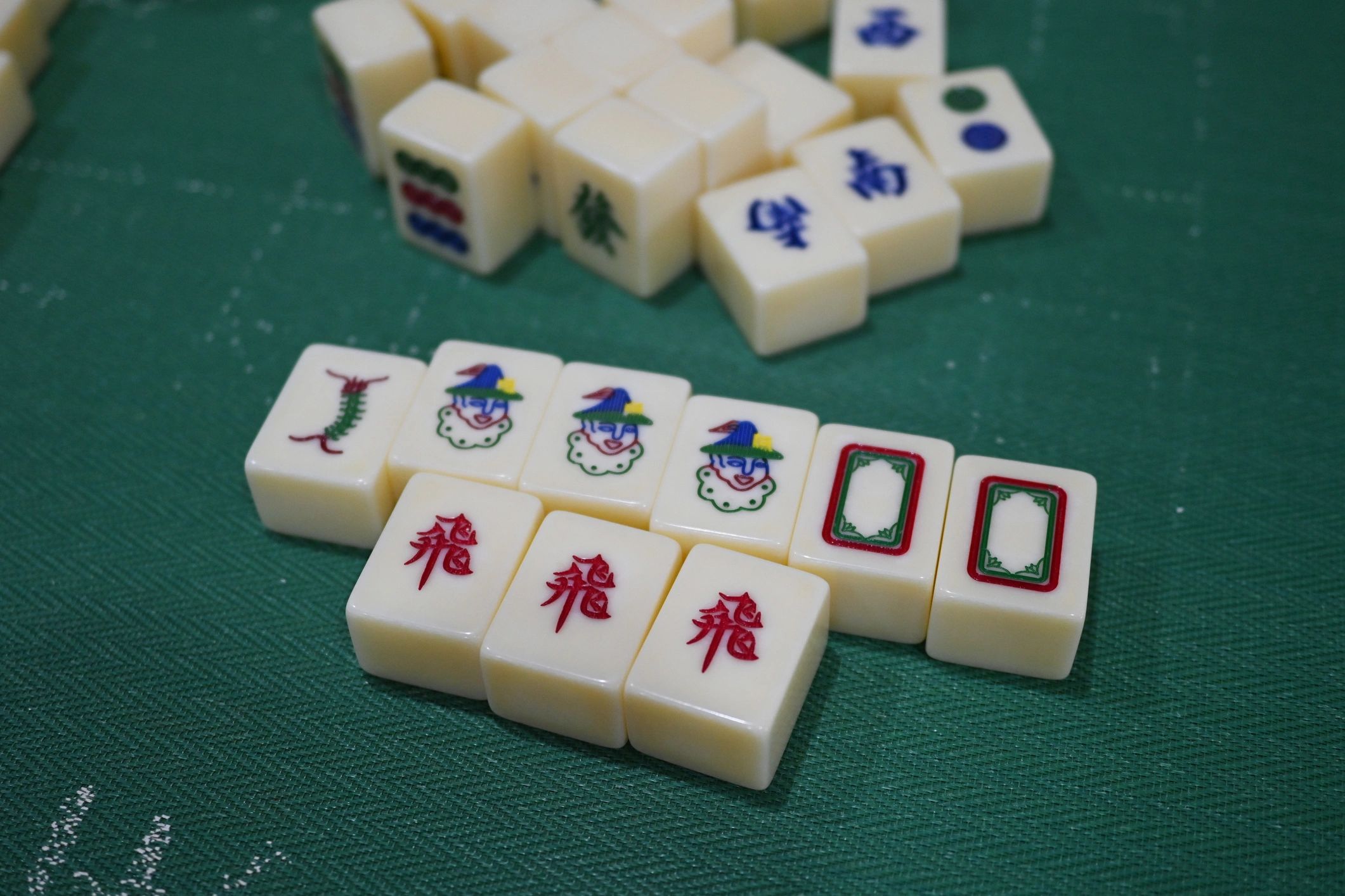 Mahjong tiles arranged for play on a table